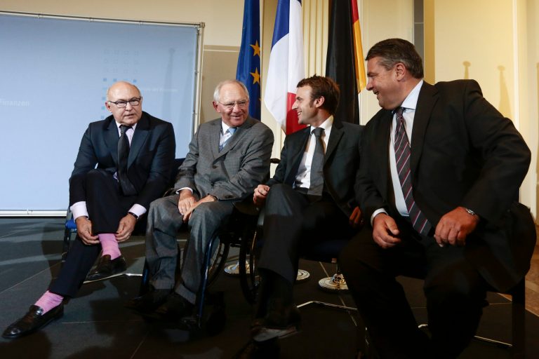 From left, France's  Finance Minister Michel Sapin, German Finance Minister Wolfgang Schaeuble,  France's  Economy Minister Emmanuel Macron and German Economy and Energy Minister Sigmar Gabriel pose for media prior to a news conference after a meeting at the finance ministry in Berlin, Monday, Oct. 20, 2014. (AP Photo/Markus Schreiber)