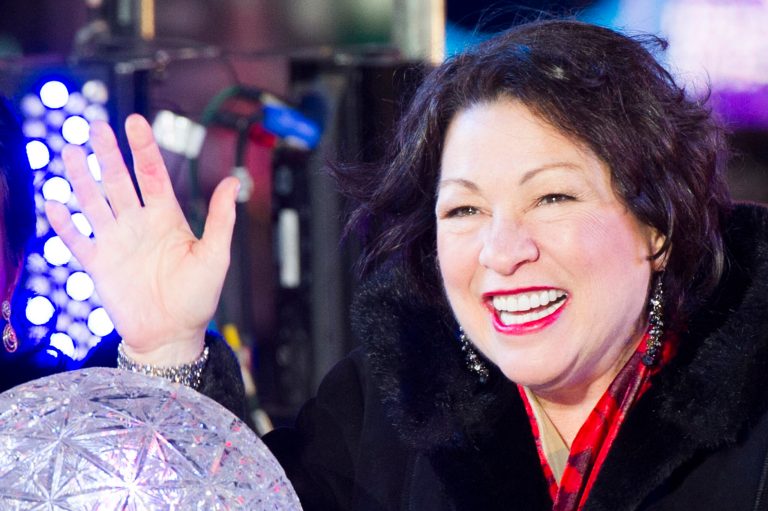 U.S. Supreme Court Justice Sonia Sotomayor pushes the Waterford crystal button that signals the descent of the New YearÃ?s Eve Ball in Times Square on Tuesday, Dec. 31, 2013 in New York. (Photo by Charles Sykes/Invision/AP)