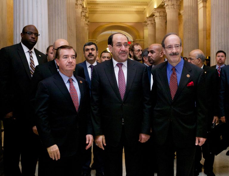 Iraq's Prime Minister Nouri al-Maliki, center, walks with Rep. Eliot Engel, D-N.Y., right, and Rep. Ed Royce, R-Calif., on Capitol Hill in Washington, Wednesday, Oct. 30, 2013, before their meeting. Earlier, the prime minister met with Vice President Joe Biden.   (AP Photo/Molly Riley)