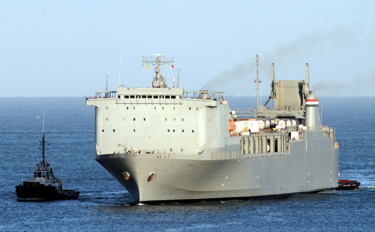 The MV Cape Ray is escorted by tug boats as it arrives at Gioia Tauro port, southern Italy, Tuesday, July 1, 2014. Syria's acknowledged stockpile of chemical weapons has been handed over to Western governments for destruction. 1300 tons of chemical weapons are currently on the Danish cargo ship Ark Futura and are expected be transferred to the U.S.-owned MV Cape Ray at Gioia Tauro. The Cape Ray, equipped with two titanium reactors, will then move into international waters to neutralize Syria's stockpile of sulphur mustard and the raw components for making sarin nerve gas over the next two months. Other materials will be disposed of at toxic wastes sites in various countries. (AP Photo/Adriana Sapone)