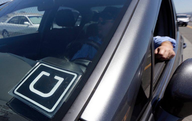 Customers will have two credits each, up to $20 per ride, to spend this weekend, Uber announced Friday. (AP Photo/Jeff Chiu, File)
