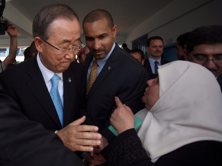 United Nations Secretary-General Ban Ki-moon speaks to a Palestinian woman in Gaza Tuesday, Oct. 14, 2014.  During the visit to Gaza Strip the U.N. chief said the destruction he saw in Gaza was 