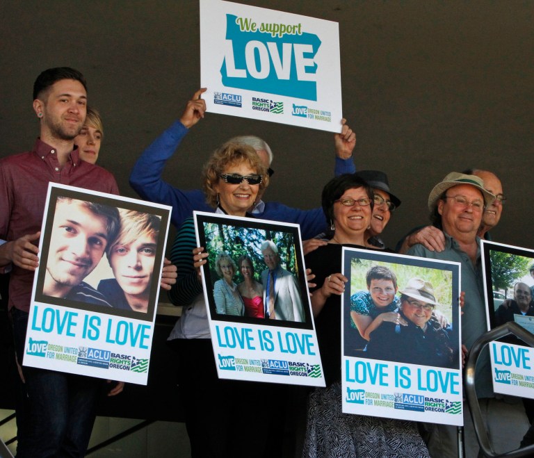 A federal judge on Monday struck down Oregon's voter-approved ban on gay marriage, saying it is unconstitutional. (AP Photo/The Register-Guard, Chris Pietsch)