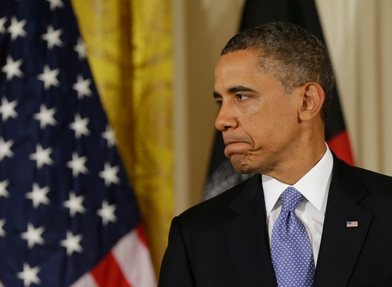 President Barack Obama pauses during his joint news conference with Afghan President Hamid Karzai in the East Room of the White House in Washington, Friday, Jan. 11, 2013. (AP Photo/Pablo Martinez Monsivais)