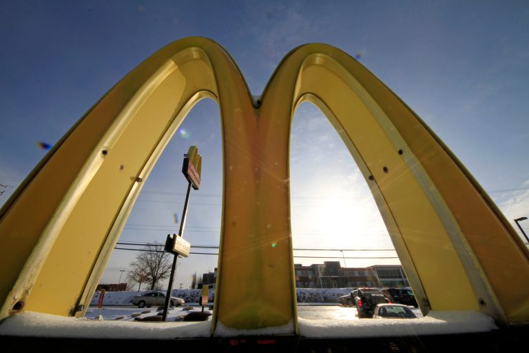In this Tuesday, Jan. 21, 2014, photo, cars drive past the McDonald's Golden Arches logo at a McDonald's restaurant in Robinson Township, Pa. McDonald's reports quarterly earnings on Thursday, Jan. 23, 2014.