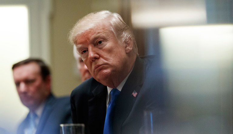 President Trump pauses during a meeting on Wednesday in the Cabinet Room of the White House with members of Congress to discuss school and community safety. (AP Photo/Carolyn Kaster)