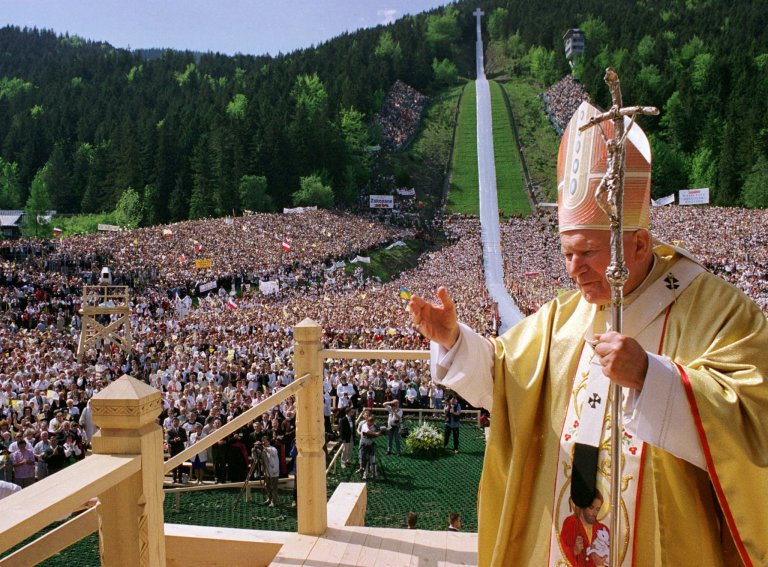 FILE - This is a Friday, June 6, 1997 file photo of Pope John Paul II as he gives the blessing to believers on a ski jumping range in Zakopane, southern Poland. The Pope is on an eleven-day tour through his home country.  Poland's Solidarity movement played a central role in the drama of ousting communism from Europe and in the breakup of the Soviet Union. From his balcony on St. Peter's Square, John Paul II became the spiritual heart of the Solidarity movement. Elected pope in 1978, his visit to his native Poland the following year rallied millions to open-air Masses, making the Poles realize they could unite in a huge, like-minded democratic force.  (AP Photo/Arturo Mari/Vatican Pool, File)