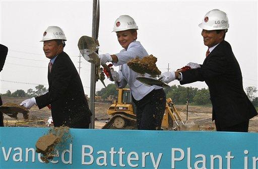 From left, LG Group Chairman Koo Bon-moo, Michigan Gov. Jennifer Granholm and LG Chem CEO Peter Bahn-Suk Kim break ground on the new LG Chem plant that will manufacture advanced batteries for Chevrolet and Ford electric cars, Thursday, July 15, 2010, in Holland, Mich. (AP Photo/Carlos Osorio)