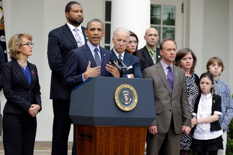 President Barack Obama gestures as he speaks during a news conference in the Rose Garden of the White House, in Washington, on Wednesday, April 17, 2013, about the defeat in the Senate of a bill to expand background checks on guns, as he is joined by former Rep. Gabby Giffords, second from left, Vice President Joe Biden, and Newtown shooting family members. (AP Photo/Manuel Balce Ceneta)