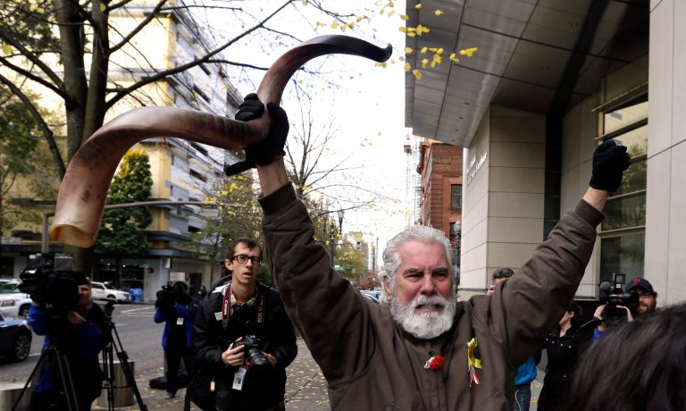 One of the occupiers celebrating the acquittal in October. (AP Photo/Don Ryan)
