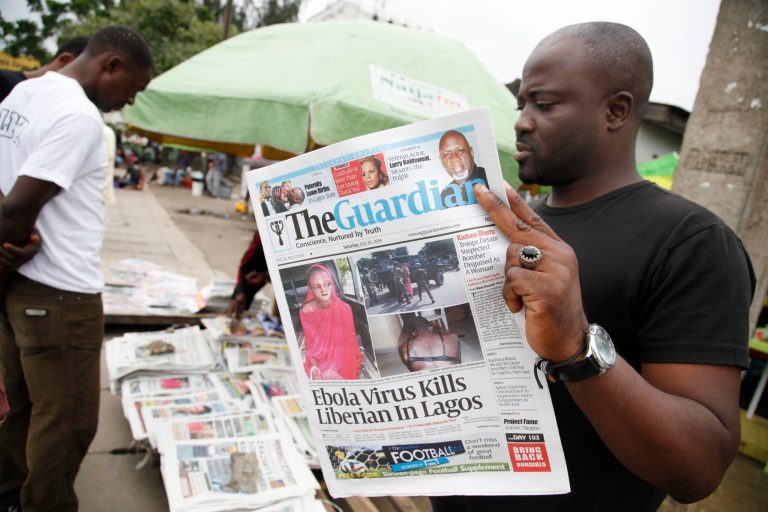 A man reads a local newspaperson a street with the headline Ebola Virus kills Liberian in Lagos, in Lagos Nigeria, Saturday, July 26, 2014. An Ebola outbreak that has left more than 600 people dead across West Africa has spread to the continent's most populous nation after a Liberian man with a high fever vomited aboard an airplane to Nigeria and then died there, officials said Friday. (AP Photo/Sunday Alamba)  The 40-year-old man had recently lost his sister to Ebola in Liberia, health officials there said. It was not immediately clear how he managed to board a flight, but he was moved into an isolation ward upon arrival in Nigeria on Tuesday and died on Friday. (AP Photo/Sunday Alamba)