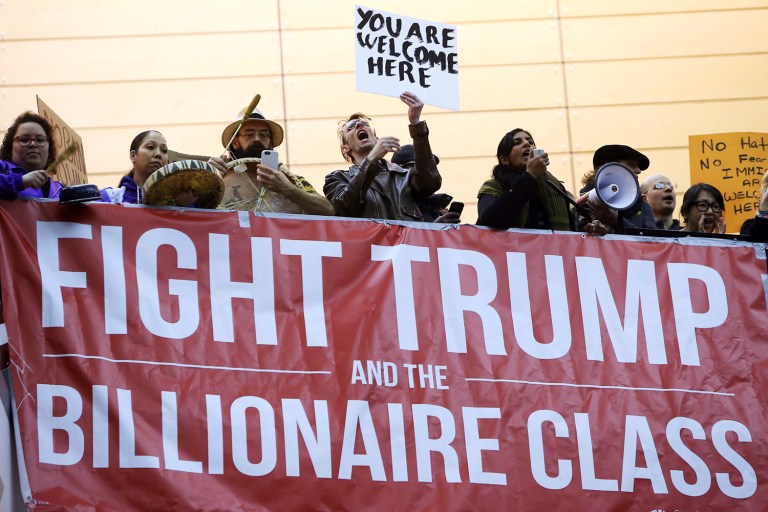 Seattle City Councilwoman and socialist activist Kshama Sawant speaks to the more than 1,000 people gathered at Seattle-Tacoma International Airport, to protest President Donald Trump's order that restricts immigration to the U.S., Saturday, Jan. 28, 2017, in Seattle. (Genna Martin/seattlepi.com via AP)