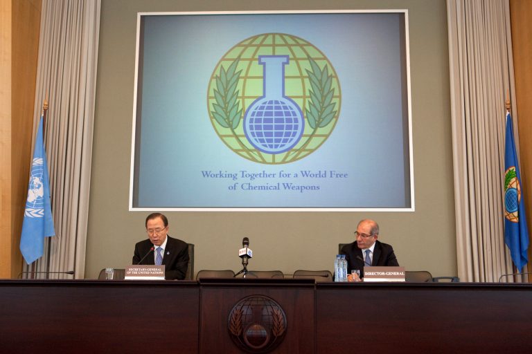 In this photo from 2013, U.N. Secretary-General Ban Ki-moon, left, speaks at the headquarters of the Organization for the Prohibition of Chemical Weapons (OPCW) in The Hague, Netherlands. At right, Director General of OPCW Ahmet Uzumcu is seen.