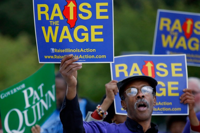 Supporters of raising the minimum wage rally. (AP Photo/Seth Perlman)