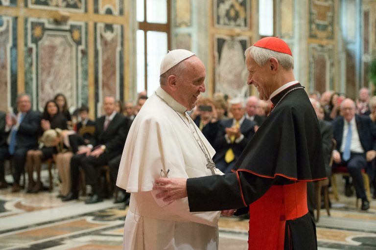 In this Friday, April 17, 2015 pool photo Pope Francis, left, talks with Papal Foundation Chairman Cardinal Donald Wuerl, Archbishop of Washinghton, D.C., during a meeting with members of the Papal Foundation at the Vatican. (L'Osservatore Romano/Pool Photo via AP)