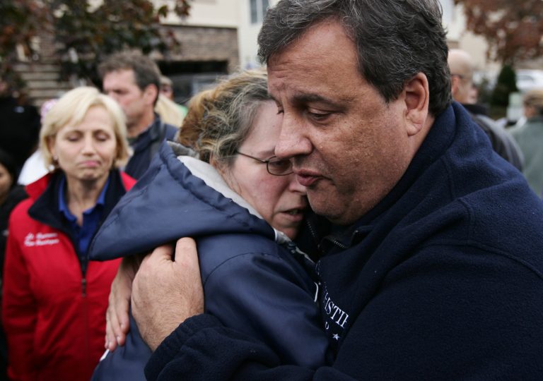New Jersey Gov. Chris Christie tries to comfort Alice Cimillo and other Moonachie, N.J. residents whose homes were damaged by Superstorm Sandy, Thursday, Nov. 1, 2012, during a tour of the flood-ravaged area. Federal officials are taking a closer look at how Christie's administration spent $25 million to promote the Jersey shore in the wake of Superstorm Sandy. (AP Photo/The Record of Bergen County, Kevin R. Wexler, Pool)