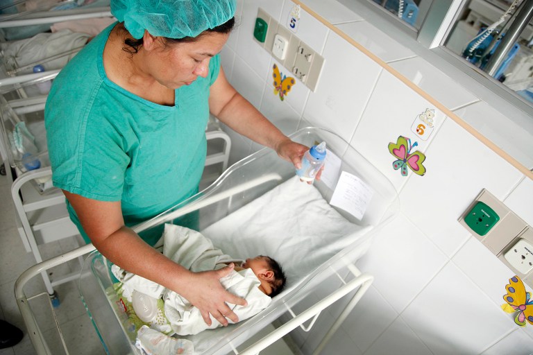 Health agency wants doctors to conduct repeated eye and hearing tests and ultrasounds on infants. (AP Photo/Fernando Antonio)