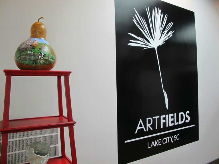 Art objects are displayed on Thursday, April 18, 2013, at the ArtFields office in Lake City, S.C. ArtFields, a 10-day arts festival runs from April 19 through April 28, 2013. Artists from 11 southeastern states are represented in the 400 works on display throughout this old tobacco community that is home to financier Darla Moore. (AP Photo/Bruce Smith)