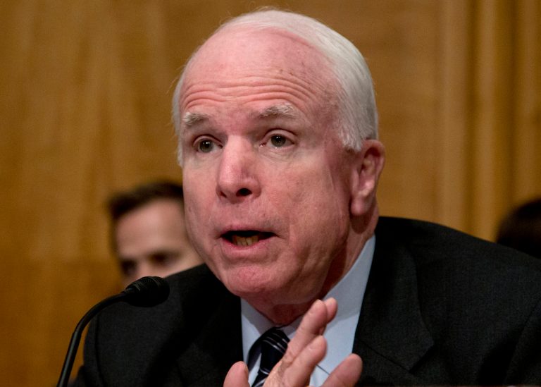 FILE - In this Nov. 13, 2013 file photo, Sen. John McCain, R-Ariz. speaks on Capitol Hill in Washington. McCain and Tim Kaine, D-Va., unveiled legislation on Thursday that would repeal the 1973 War Powers Resolution, often ignored by presidents of both parties, and replace it with a new law that requires greater consultation and a congressional vote within 30 days on any significant armed conflict. (AP Photo/Carolyn Kaster, File)