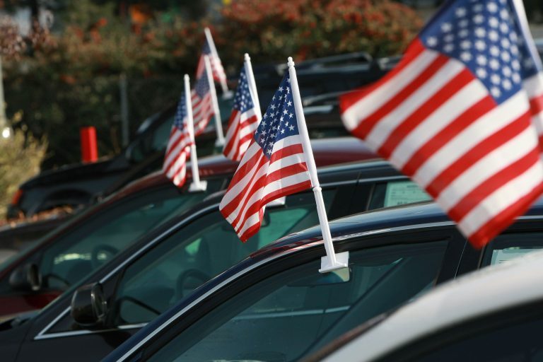 American flags are seen on cars for sale at Santa Rosa Chevrolet December 12, 2008 in Santa Rosa, California. Auto dealerships continue to see a sharp decline in sales as the Big Three U.S. automakers face possible bankruptcy following a federal bailout that failed to pass through the U.S. Senate. (Photo by Justin Sullivan/Getty Images)