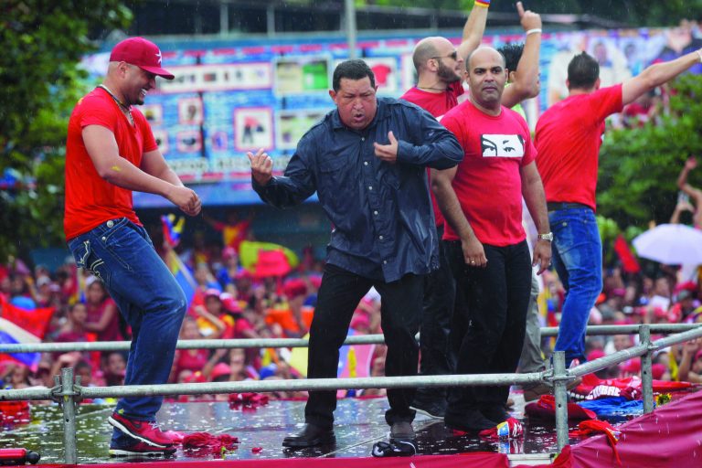 Venezuela's President Hugo Chavez, second from right, dances after delivering a speech during his closing campaign rally in Caracas, Venezuela, Thursday, Oct. 4, 2012. Chavez is running for re-election against opposition candidate Henrique Capriles in presidential elections on Oct . 7. (AP Photo/Ariana Cubillos)