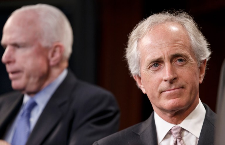 Sen. Bob Corker, right, believes calling Russian hacking an 