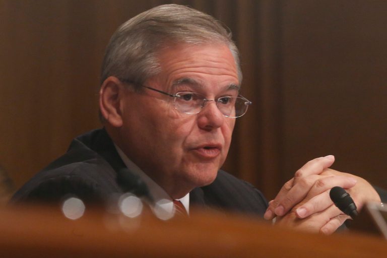 Sen. Robert Menendez, D-N.J., questions ousted IRS Chief Steve Miller, former IRS Commissioner Douglas Shulman, J. Russell George, Treasury Inspector General for Tax Administration, testify during a hearing at the Senate Finance Committee on the Internal Revenue Service (IRS) practice of targeting applicants for tax-exempt status based on political leanings on Capitol Hill, in Washington, Tuesday, May 21, 2013. (AP Photo/Charles Dharapak)