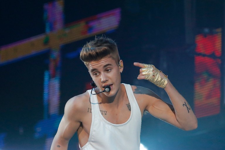 FILE - This March 19, 2013 file photo shows Canadian singer Justin Bieber performing during a concert at Bercy arena in Paris. Bieber has visited the Anne Frank House in Amsterdam, with a museum spokeswoman saying the Canadian pop star wrote in the guestbook that he hoped Frank 