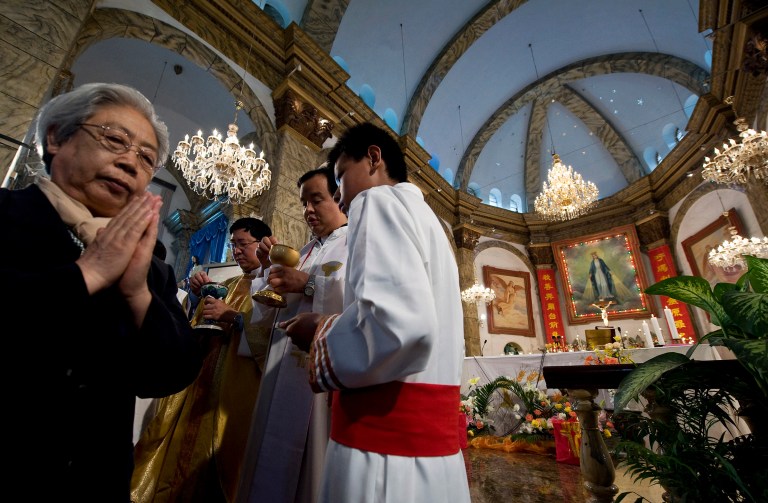 Catholics in China live under some pretty harrowing and confusing circumstances. (AP Photo/Andy Wong)