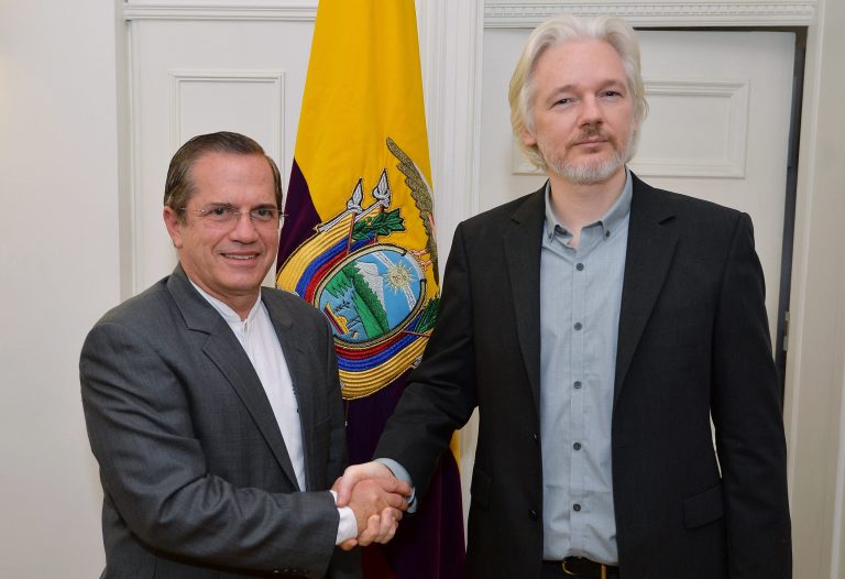 Ecuador's Foreign Minister Ricardo Patino, left, shakes hands with WikiLeaks founder Julian Assange after a press conference inside the Ecuadorian Embassy in London, Monday Aug. 18, 2014, where Assange confirmed he 