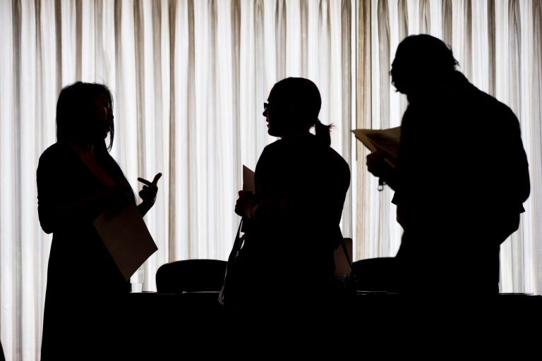 In this June 23, 2014 photo, recruiter Christina O, left, with New Western Acquisitions, meets with employment seekers during a job fair in Philadelphia. The Labor Department reports on the number of people who applied for unemployment benefits last week on Thursday, Sept. 4, 2014. (AP Photo/Matt Rourke)