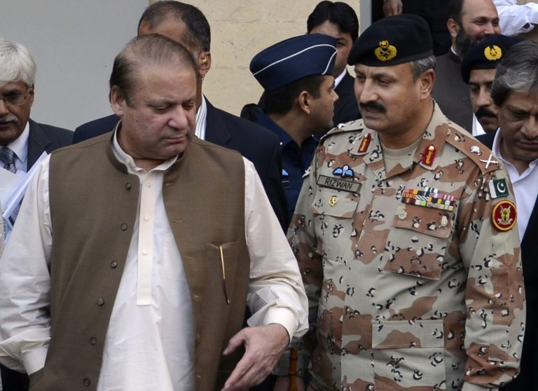 In this undated handout photo released by Pakistan's rangers, Maj. Gen. Rizwan Akhtar, right, walks with Prime minister Nawaz Sharif in Karachi, Pakistan. Pakistan's army on Monday, Sept. 22, 2014, named a new chief to head the country's premier intelligence agency, the Inter-Services Intelligence Directorate, which is also known by its acronym ISI. (AP Photo/Pakistan Rangers)
