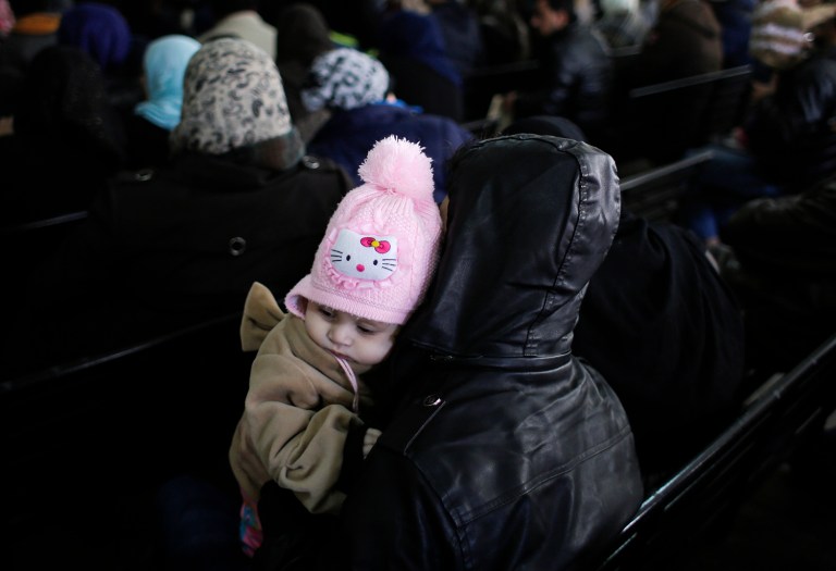 Syrian families waits to register at the United Nations High Commissioner for Refugees headquarters, in Beirut, Lebanon, Monday, Jan. 30, 2017. By executive order, U.S. President Donald Trump imposed a 90-day ban, Friday, that affects travel to the U.S. by citizens of Iraq, Syria, Iran, Sudan, Libya, Somalia and Yemen and puts an indefinite hold on a program resettling Syrian refugees. (AP Photo/Hassan Ammar)