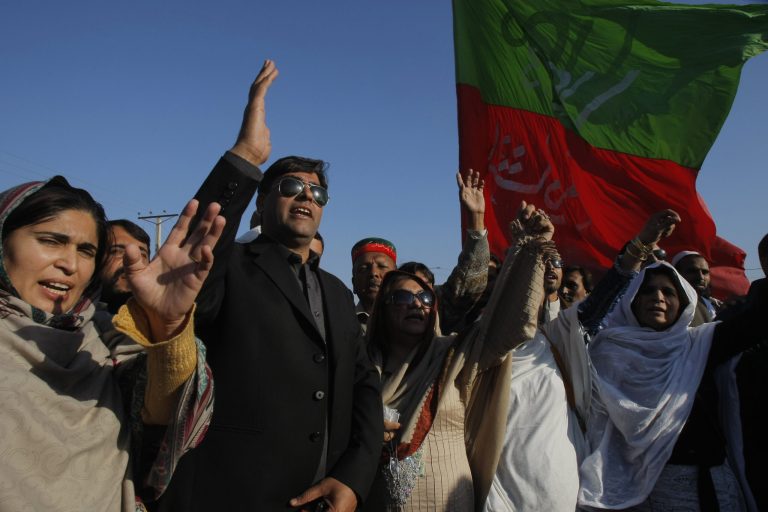 Supporters of Pakistani political party Tehreek-e-Insaf condemn American drone attacks in Pakistani, while holding a rally Thursday, Dec. 26, 2013, in Peshawar, Pakistan. A suspected American drone fired two missiles at a home in a northwestern tribal region bordering Afghanistan, killing several foreign militants, Pakistani intelligence officials said Thursday. (AP Photo/Mohammad Sajjad)