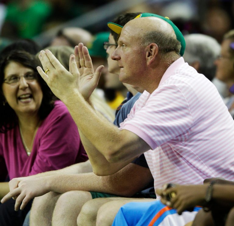   FILE - This July 23, 2011 file photo shows Microsoft CEO Steve Ballmer cheering during a charity basketball game in Seattle. The push to build a new arena in Seattle with the hopes of seeing the NBA return now has another name to go along with that of hedge-fund manager Chris Hansen. Ballmer will be part of the investment group for both the arena and the acquisition of an NBA franchise, according to a letter sent Wednesday, June 13, 2012 by Hansen to King County Executive Dow Constantine and Seattle Mayor Mike McGinn. A copy of the letter was obtained by The Associated Press. (AP Photo/Ted S. Warren, File)  