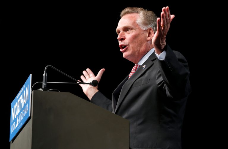 Virginia Governor Terry McAuliffe gestures during a rally in Richmond, Va., Thursday, Oct. 19, 2017. (AP Photo/Steve Helber)