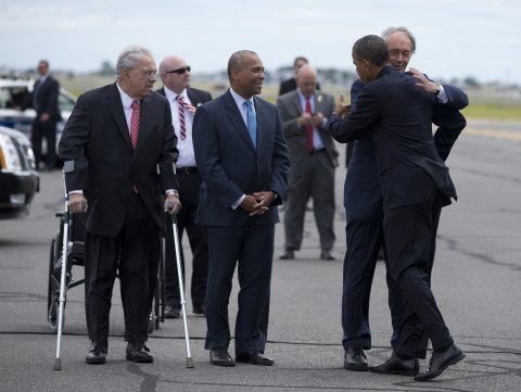 President Obama is greeted by Massachusetts Senate candidate, Rep. Ed Markey, right, accompanied by Boston Mayor Thomas Menino, left, and Massachusetts Gov Deval Patrick, center, upon his arrival at Logan International Airport in Boston, Wednesday. Obama traveled to Boston to campaign for Markey's Massachusetts Democratic Senate campaign. (AP Photo/Evan Vucci)