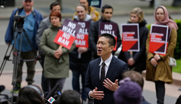 Hawaii Attorney General Doug Chin talks to reporters outside a federal courthouse in Seattle. A U.S. appeals court is allowing C-SPAN to broadcast oral arguments on President Trump's travel ban. The 9th Circuit will hear arguments on Dec. 6 in Seattle. (AP Photo/Ted S. Warren, File)
