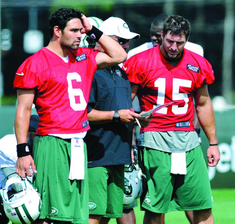 Bill Kostroun/AP
The Jets brought in Tim Tebow, right, in the offseason to compete with Mark Sanchez.