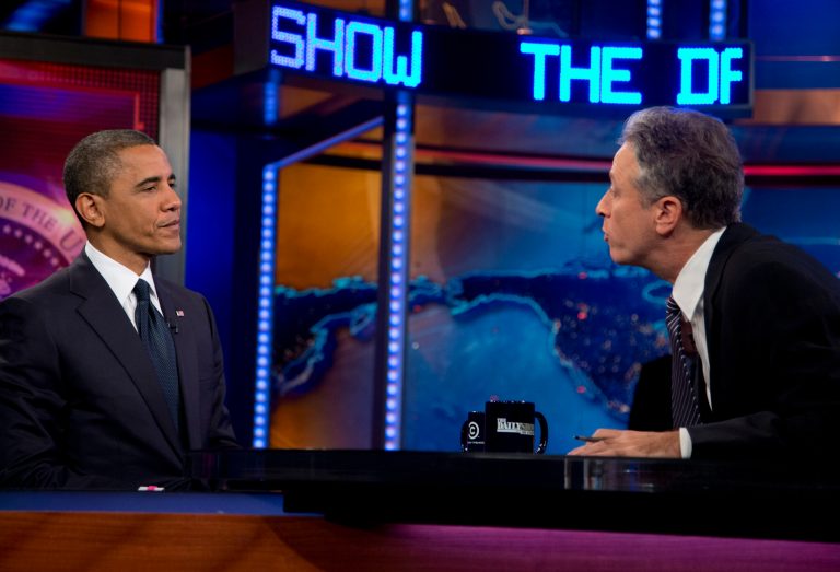President Obama talks with Jon Stewart during a taping of his appearance on 