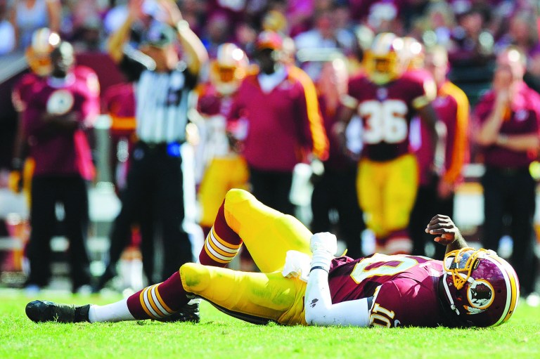 Patrick McDermott/Getty Images
Washington Redskins quarterback Robert Griffin III ran 12 times for 85 yards on Sunday but was also sacked six times and hit another 13 times in the backfield.