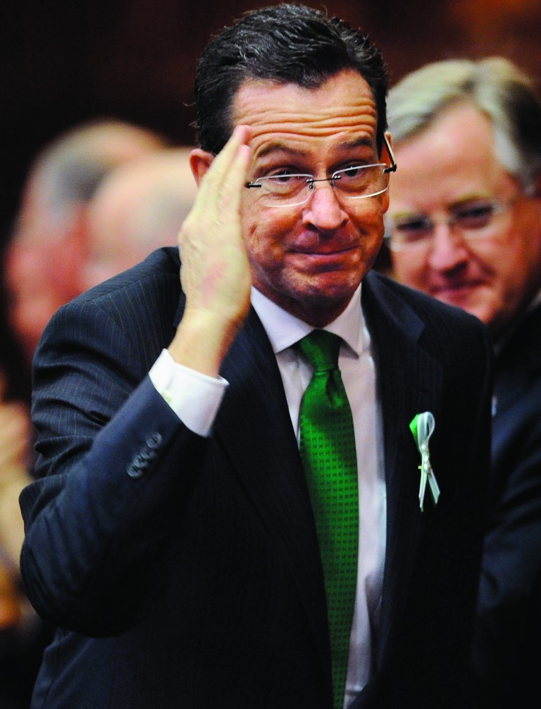 Connecticut Gov. Dannel P. Malloy, salutes as he arrives to speak to the House and the Senate in his State of the State address at the Capitol in Hartford, Conn., Wednesday, Jan. 9, 2013. Gun control, mental health care and school safety are expected to be major topics in the new session. Legislators also must grapple with a projected deficit of about $1.2 billion. (AP Photo/Jessica Hill)