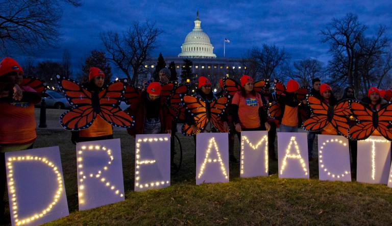 Demonstrators rally in support of Deferred Action for Childhood Arrivals outside the Capitol. Republicans have staunchly opposed linking immigration and government spending in a single bill, but the Senate's failure to pass an immigration reform bill raises the chances an immigration measure will end up hitching a ride on the upcoming spending bill, which must pass by March 23. (AP Photo/Jose Luis Magana)