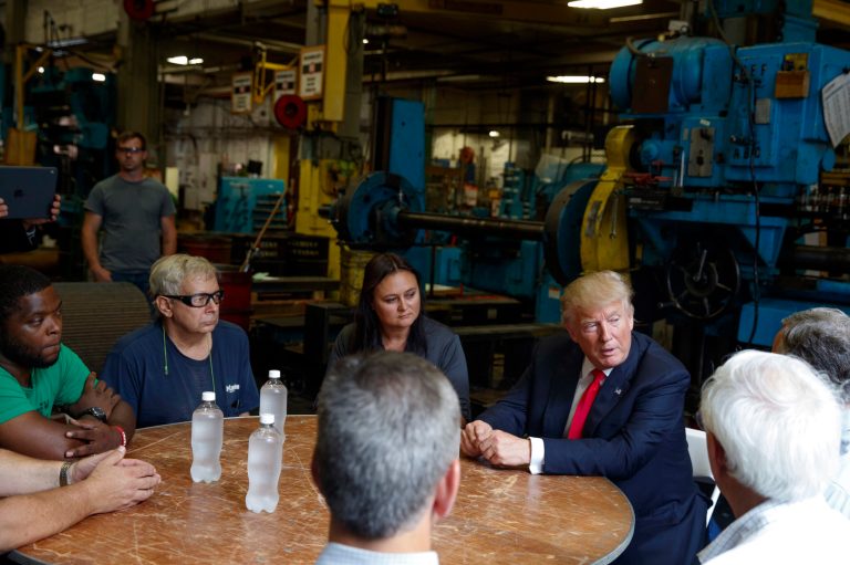 Republican presidential candidate Donald Trump talks with a group of factory workers during a tour of McLanahan Corporation headquarters, a company that manufactures mineral and agricultural equipment, Friday, Aug. 12, 2016, in Hollidaysburg, Pa. (AP Photo/Evan Vucci)