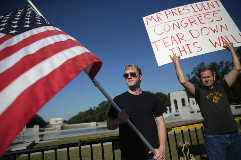 Joe Lee (L) and Lance Frye (R) of Woodbridge, Va., protest outside the World War II Memorial in Washington, DC. (Alex Wong/Getty Images)