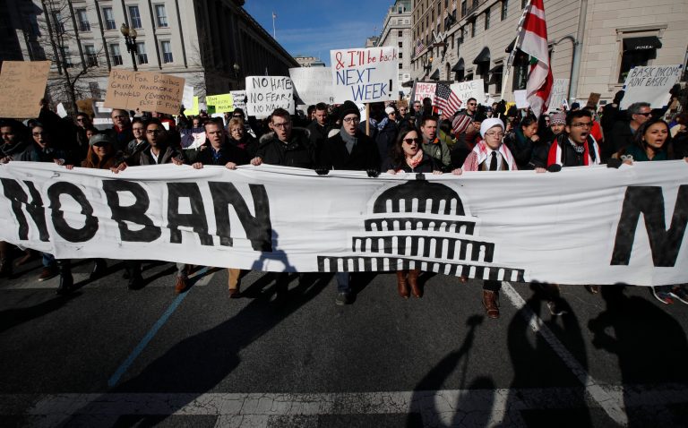 Protesters march from Lafayette Park near the White House in Washington, Saturday, Feb. 4, 2017, during a rally protesting the immigration policies of President Donald Trump. (AP Photo/Manuel Balce Ceneta)