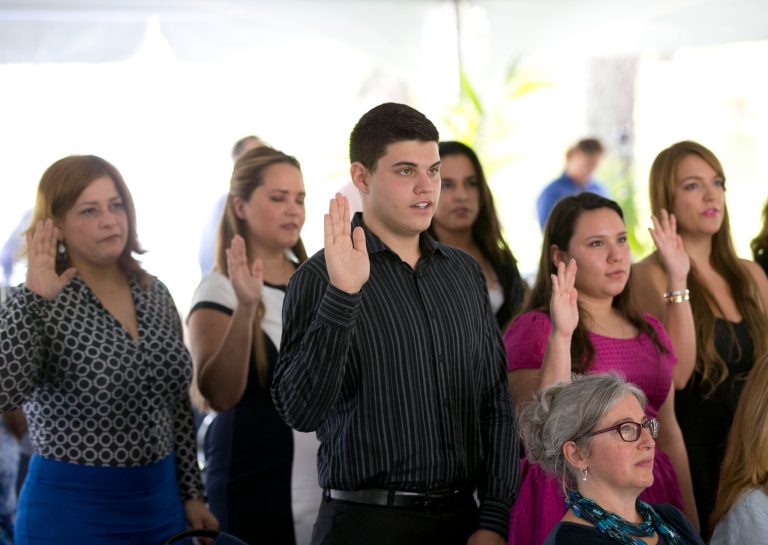 New citizens take the Oath of Allegiance during a naturalization ceremony Monday, July 6, 2015, in Miami. (AP)