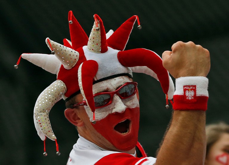   A Polish fan cheers before the Euro 2012 soccer championship Group A match between Czech Republic and Poland in Wroclaw, Poland, Saturday, June 16, 2012. (AP Photo/Petr David Josek)  