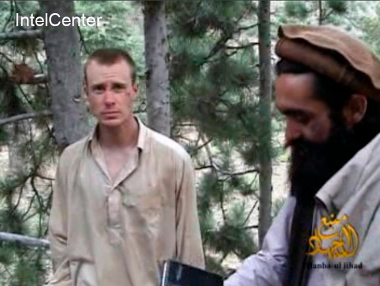 FILE - This file image provided by IntelCenter on Dec. 8, 2010, shows a frame grab from a video released by the Taliban containing footage of a man believed to be Bowe Bergdahl, left.  Saturday, May 31, 2014, U.S. officials say Bergdahl, the only American soldier held prisoner in Afghanistan has been freed and is in U.S. custody. The officials say his release was part of a negotiation that includes the release of five Afghan detainees held in the U.S. prison at Guantanamo Bay, Cuba. (AP Photo/IntelCenter, File)  MANDATORY CREDIT: INTELCENTER; NO SALES; EDS NOTE: 