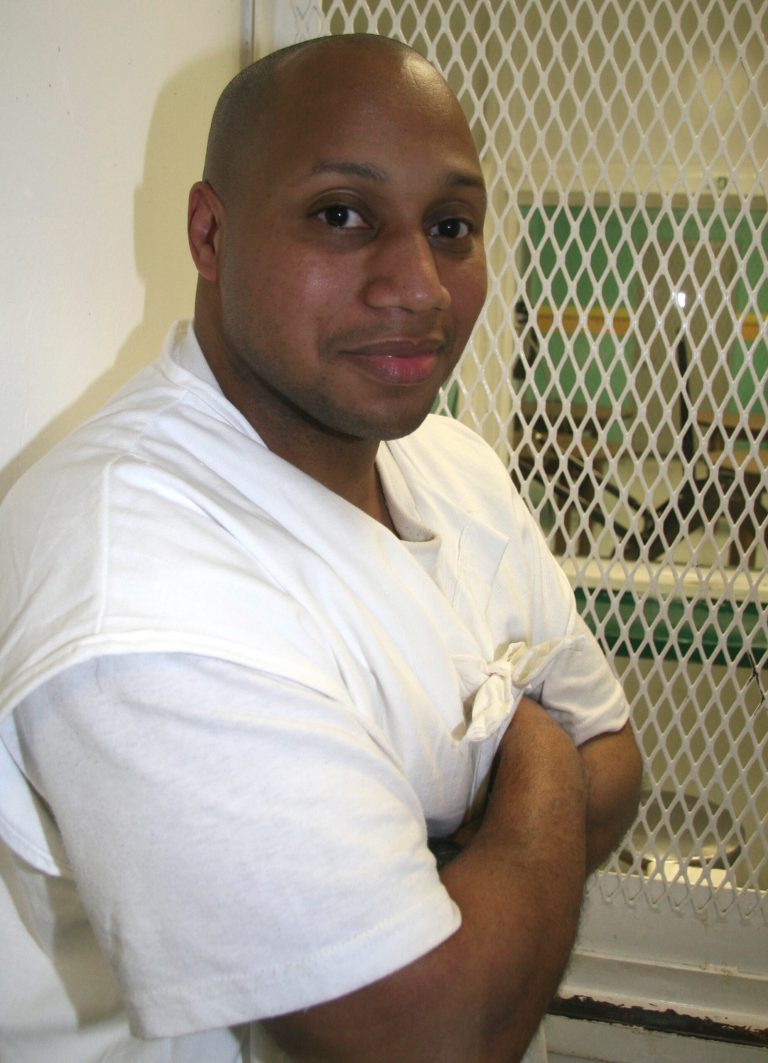 In a July 30, 2014 photo, condemned inmate Willie Trottie poses in a visiting cage outside death row at the Polunsky Unit, in Livingston, Texas. Trottie is scheduled to be executed Wednesday, Sept. 10 for killing his common-law wife Barbara Canada and her brother Titus Canada. (AP Photo/Mike Graczyk)